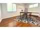 Bright bedroom featuring hardwood floors, a cozy rug, and ample natural light at 2633 Quitman St, Denver, CO 80212