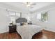 Serene bedroom with wood floors, large windows, and comfortable furnishings creating a relaxing retreat at 2633 Quitman St, Denver, CO 80212