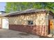 Two-tone brick garage with a side entry door at 2633 Quitman St, Denver, CO 80212