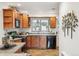 Inviting kitchen with natural wood cabinets, stainless steel appliances and ample countertop space at 2633 Quitman St, Denver, CO 80212