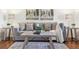 Detailed view of the living room with a comfortable sofa, stylish coffee table and hardwood floors at 2633 Quitman St, Denver, CO 80212