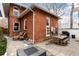 Backyard patio area with outdoor dining furniture and cozy seating at 1614 Gaylord St, Denver, CO 80206