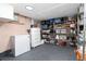 Functional basement featuring shelving for ample storage, a freezer, and clean floors at 1614 Gaylord St, Denver, CO 80206