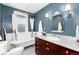 Elegant bathroom with a clawfoot tub, marble countertop vanity, and classic fixtures, creating a luxurious space at 1614 Gaylord St, Denver, CO 80206