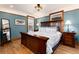 Bedroom featuring hardwood floors, an arts-and-crafts style bedframe, and a mirror at 1614 Gaylord St, Denver, CO 80206