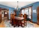 Stunning dining room featuring a chandelier, wood table, and hardwood floors at 1614 Gaylord St, Denver, CO 80206