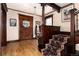 Elegant entryway with hardwood floors, decorative staircase, and wooden accents at 1614 Gaylord St, Denver, CO 80206