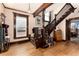 Grand foyer featuring a wooden staircase, window seat, and decorative chandelier at 1614 Gaylord St, Denver, CO 80206