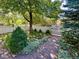 Beautiful landscaped front yard with a brick path and a classic white picket fence at 1614 Gaylord St, Denver, CO 80206