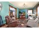 Inviting living room showcasing hardwood floors and a large TV at 1614 Gaylord St, Denver, CO 80206