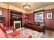 Cozy living room featuring a decorative fireplace, hardwood floors, and a comfortable leather sofa at 1614 Gaylord St, Denver, CO 80206