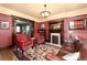 This is the living room area with red armchairs and a fireplace at 1614 Gaylord St, Denver, CO 80206