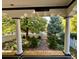 Elegant porch featuring classic columns and a view of the well-maintained front yard at 1614 Gaylord St, Denver, CO 80206