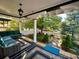 Covered porch with a seating area, stylish outdoor rug, and views of the landscaped front yard at 1614 Gaylord St, Denver, CO 80206