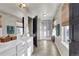 Double vanity bathroom with a large shower and natural light at 20727 Park Hollow Dr, Parker, CO 80138