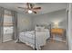 Bedroom with dark metal frame bed, wooden side table, and plenty of light at 20727 Park Hollow Dr, Parker, CO 80138