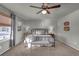 Serene primary bedroom with an iron bed frame, bench, and neutral decor at 20727 Park Hollow Dr, Parker, CO 80138