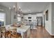 Bright dining area adjacent to kitchen, featuring hardwood floors and modern decor at 20727 Park Hollow Dr, Parker, CO 80138