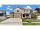 Two-story house with attached two-car garage, front porch and landscaping at 20727 Park Hollow Dr, Parker, CO 80138