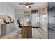 Spacious home office with a large desk, built-in shelving and window light at 20727 Park Hollow Dr, Parker, CO 80138