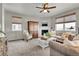 Cozy living room with fireplace, comfortable seating, and built-in cabinet at 20727 Park Hollow Dr, Parker, CO 80138