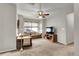 Cozy living room with plush seating, ceiling fan, and built-in entertainment center at 20727 Park Hollow Dr, Parker, CO 80138