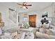 Neutral living room with hardwood floors and comfy seating at 20727 Park Hollow Dr, Parker, CO 80138