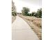 A long walking path surrounded by trees and foliage at 20727 Park Hollow Dr, Parker, CO 80138