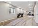 Spacious finished basement with light wood floors and plenty of room for recreation and hobbies at 2785 S Lisbon Way, Aurora, CO 80013