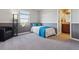Cozy bedroom with two-tone walls, plush carpeting, and a comfortable bed with blue accents at 2785 S Lisbon Way, Aurora, CO 80013