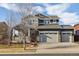 Beautiful two-story home with a three-car garage and a covered front porch at 2785 S Lisbon Way, Aurora, CO 80013