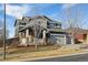 Charming two-story home with stone accents, a three-car garage, and well-maintained landscaping at 2785 S Lisbon Way, Aurora, CO 80013