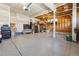 Spacious garage with epoxy floors, ample storage space, and a well-lit ceiling at 2785 S Lisbon Way, Aurora, CO 80013
