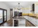 Bright kitchen with large island, modern appliances, and eat in bar at 2785 S Lisbon Way, Aurora, CO 80013