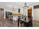 Well-equipped kitchen boasts an island, modern appliances, ample cabinetry, and a dining area at 2785 S Lisbon Way, Aurora, CO 80013