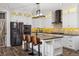 Charming kitchen features a large island, stainless steel appliances, and modern lighting at 2785 S Lisbon Way, Aurora, CO 80013