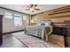 Inviting main bedroom features an accent wall, large windows, and plush carpet at 2785 S Lisbon Way, Aurora, CO 80013