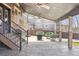 Covered patio with stamped concrete flooring, ceiling fan, and comfortable seating area at 2785 S Lisbon Way, Aurora, CO 80013