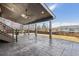 Outdoor covered patio area with stamped concrete, ceiling fans, and a view of the backyard at 2785 S Lisbon Way, Aurora, CO 80013