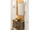 Stylish powder room featuring vessel sink, custom vanity, and accent wall at 155 S Poplar St, Denver, CO 80230