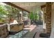 Relaxing covered patio with a built-in grill, seating, and string lights at 155 S Poplar St, Denver, CO 80230