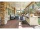 Beautiful covered patio featuring a grill, comfortable seating, and a ceiling with string lights at 155 S Poplar St, Denver, CO 80230