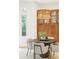 Inviting breakfast nook with custom chandelier and a view to the backyard at 155 S Poplar St, Denver, CO 80230