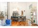 Elegant dining room featuring an ornate chandelier, oversized furniture, and ample natural light at 155 S Poplar St, Denver, CO 80230