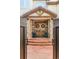 Inviting entrance featuring a stone facade, custom wooden doors, and manicured planters creating a welcoming ambiance at 155 S Poplar St, Denver, CO 80230