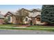 Stunning exterior featuring beautiful stone accents and meticulous landscaping for curb appeal at 155 S Poplar St, Denver, CO 80230