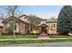 Elegant home exterior with stone accents, well-manicured landscaping, and a welcoming entrance at 155 S Poplar St, Denver, CO 80230