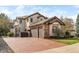 Stunning property featuring a three-car garage, basketball hoop, and a meticulously maintained driveway and lawn at 155 S Poplar St, Denver, CO 80230