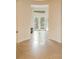 Welcoming foyer with arched entry and French doors leading to a tranquil outdoor space at 155 S Poplar St, Denver, CO 80230