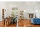 Inviting living room with a fireplace, chandelier, and access to an outdoor balcony, perfect for entertaining at 155 S Poplar St, Denver, CO 80230